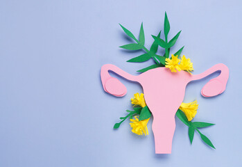 Woman's health. Paper uterus and flowers on light blue background, flat lay with space for text