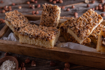 Cake with nuts on wooden table