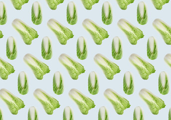 Pattern design with fresh Chinese cabbages on pale light blue background