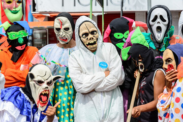 Group of people parading dressed in horror costumes at the carnival