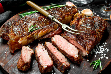 Grilled beef steak with rosemary and spices.