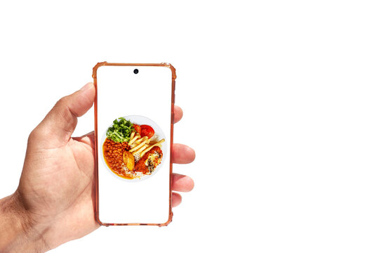 Hand holding smartphone with typical Brazilian meal known as Prato Feito on screen
