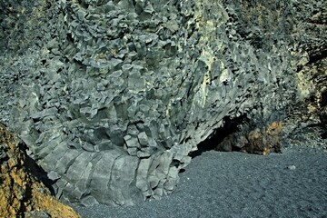 Iceland-view of rock formations Reynisdrangar situated of Reynisfjara beach by the village Vík