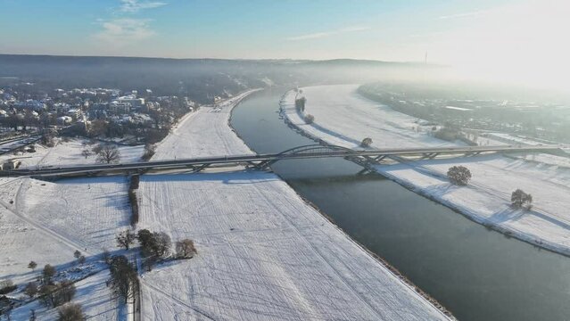 Aerial drone flight over the Waldschl&ouml;sschenbr&uuml;cke in dresden with snow. drone move to the right