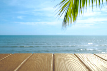 Beautiful foreground wooden floor and blue sea and sky background.
