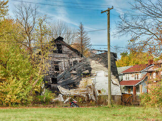 Empty Lot With Damaged House