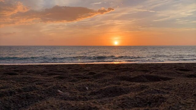 A timelapse of the sun setting into the sea