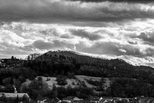 Little village in the middle of the countryside with church on the hill