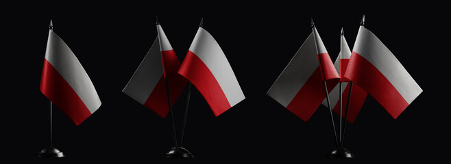 Small national flags of the Poland on a black background