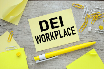 words DEI workplace text on yellow sticker. yellow pen. Business DEI diversity equity inclusion ....