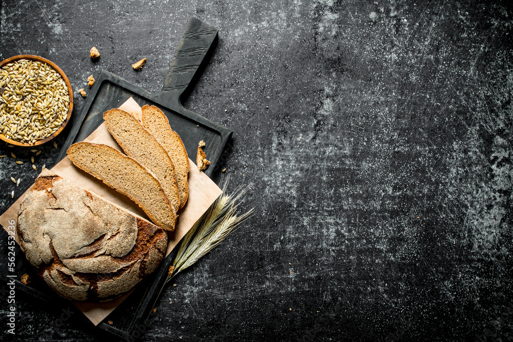 Wall mural Pieces of bread with spikelets.