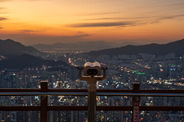 Panoramic and Night view of apartments and high-rise buildings at downtown Busan seen from...