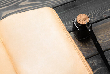 Open blank page book with copy space and ball pen on the wooden table flat lay table background.