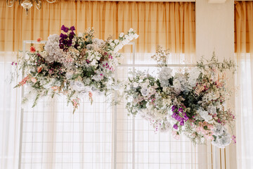Flower Decoration Hanging from Ceiling Indoor Photography. Attractive Floral Ornament Decorating Restaurant Or Apartment Room. Festival Natural and Elegant Decor of Celebrative Event