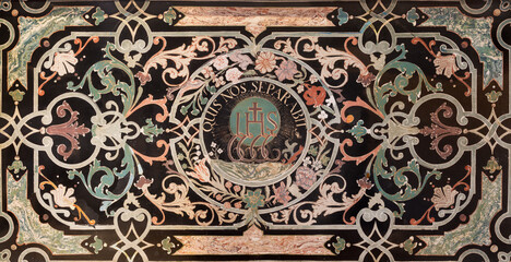 LUZERN, SWITZERLAND - JUNY 24, 2022: The IHS initials in the stone mosaic (Pietra dura) in the church St. Leodegar im Hof by unknown artist of 17. cent.