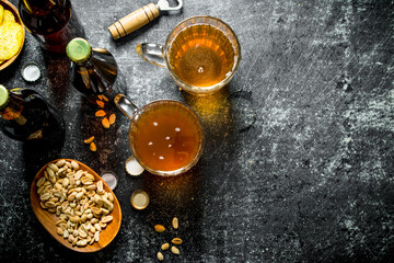 Beer and snacks in the bowls.