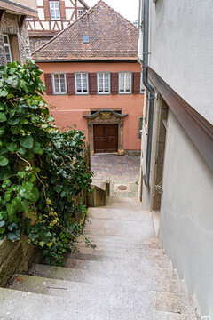 Old half-timber houses with colored shutters and long stairways