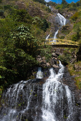 Yellow bridge over the Silver Falls in Sapa, Vietnam
