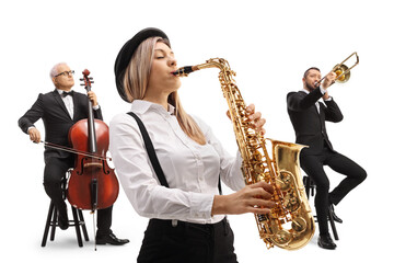 Woman playing a sax and two men in the back playing a trombone and a cello