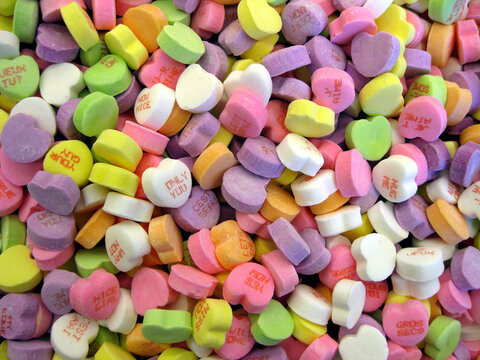 Sweethearts: background of candy hearts with messages on them.