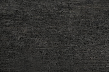 Texture of black stone surface as background, closeup
