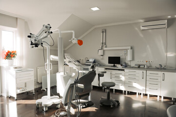 Concept of dental. stomatology concept - interior of new modern dental clinic office with chair.. Dental equipment