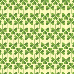 Saint Patrick's Day greetings with tree leaf clovers on green background.