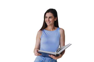 Beautiful brunette Spanish girl with long hair standing at kitchen holds book looks at camera dressed in blue t-shirt and jeans. Gorgeous young fit woman against transparent background. Model relaxing