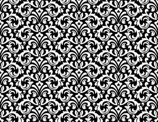 Wallpaper in the style of Baroque. Seamless vector background. White and black floral ornament. Graphic pattern for fabric, wallpaper, packaging. Ornate Damask flower ornament