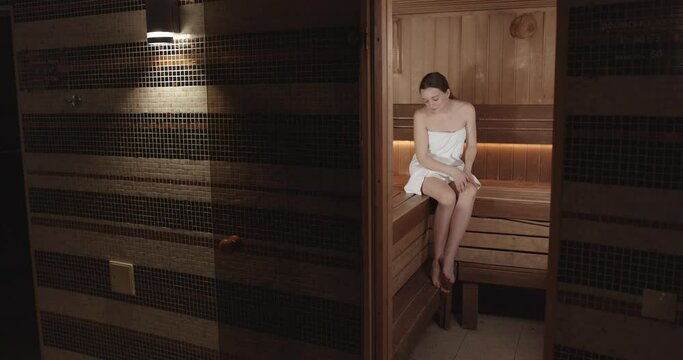 Young lady taking time in wellness spa center