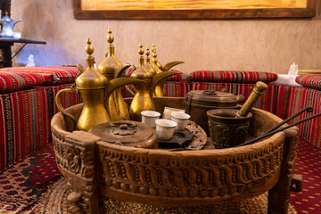 coffeepot and a coffee mug. Drinking coffee in Arabic style. Coffee house