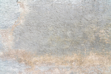 Eine alte graue Mauer mit schöner Struktur als Hintergrund