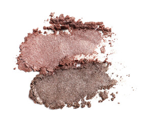 Crushed eye shadows on white background, top view. Professional makeup product