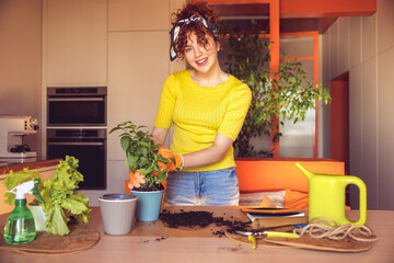 Cute merry young girl making home gardening works