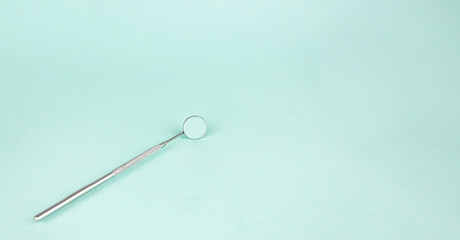 Dentist Professional tools medical equipment on Blue background. Dental Hygiene and Health conceptual image Pile of dentist tools lying on blue background.