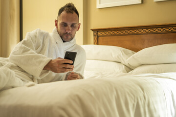 Man Checking His Social Media Profiles Before Going to Sleep