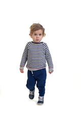 front view of a baby boy walking on white background