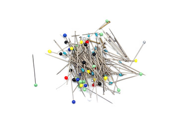 a group of needles on white table