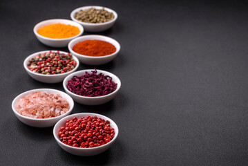Composition consisting of a variation of several types of spices in white bowls