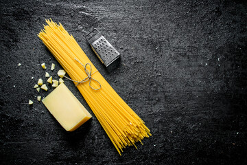 Raw spaghetti with Parmesan.
