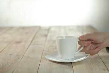 person holding a cup with coffee