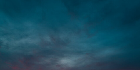 Fototapeta na wymiar Dramatic blue sky panorama at orange sunset