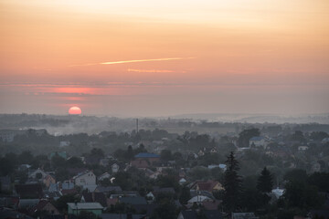 Naklejka premium Smog over the city at sunset. Fog. Selective focus. Blurred background.