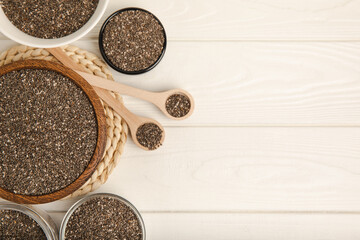 Chia seeds in jar and spoons on white texture wood. Superfood. Antioxidant. Healthy food. Proper nutrition. Diet concept. Place for text. Place to copy. selective focus.