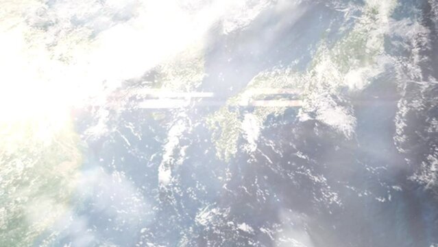 Earth zoom in from outer space to city. Zooming on Omuta, Fukuoka, Japan. The animation continues by zoom out through clouds and atmosphere into space. Images from NASA
