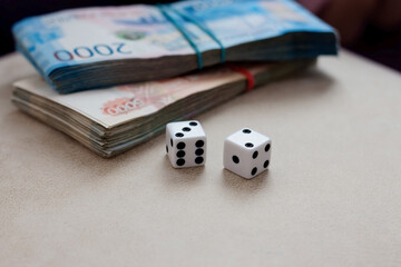 Dice on the background of money