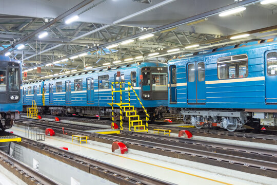 Passenger trains arriving for service at the electric depot.