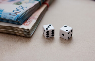 Dice on the background of money