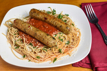 whole wheat spaghetti served with plant base sausage