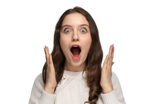 Close up portrait of beautiful darkhaired woman spreading hands, standing isolated over background, astonished female with widely opened mouth wearing white sweater. People emotions concept.